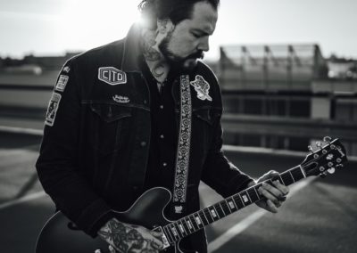 Kit Langfield playing guitar